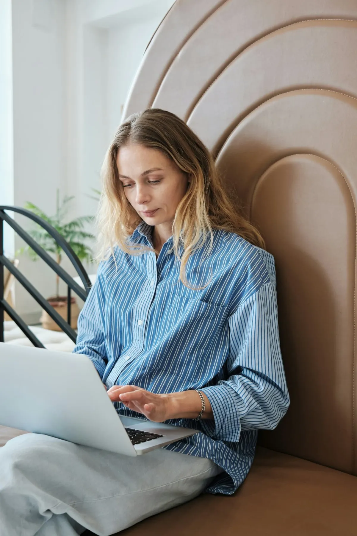 Woman using a laptop at home